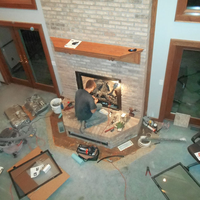 fireplace specialists repairing gas fireplace in WI