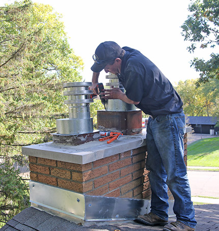 What can i put in the top of my chimney to get this flue pipe centered in  the block? : r/masonry